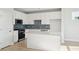 Bright kitchen with white cabinetry, blue tile backsplash, and a large island at 420 Queen View Ln, Charleston, SC 29414