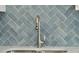 Close up of stainless steel kitchen sink and faucet with blue tile backsplash at 420 Queen View Ln, Charleston, SC 29414