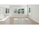 Bright and airy living room boasting large windows and modern flooring for a seamless design at 420 Queen View Ln, Charleston, SC 29414