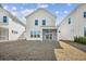 Rear view of white home featuring a screened-in porch and spacious backyard at 422 Queenview Ln, Charleston, SC 29414