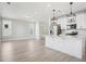 Open concept kitchen with white cabinets and stainless appliances at 422 Queenview Ln, Charleston, SC 29414
