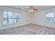 Bedroom featuring carpet floors, two bright windows and neutral color to create a restful atmosphere at 476 E Wimbledon Dr, Charleston, SC 29412