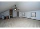 Expansive bonus room featuring a ceiling fan and unique architectural elements at 476 E Wimbledon Dr, Charleston, SC 29412