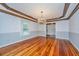 Dining area featuring gleaming wood floors and an elegant chandelier at 476 E Wimbledon Dr, Charleston, SC 29412