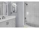 Bright bathroom featuring a white tub and sink vanity with an above-the-sink mirror at 4791 Arco Ln, North Charleston, SC 29418