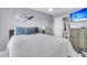 Comfortable bedroom with soft decor featuring a flat screen TV and open access to a bathroom at 4791 Arco Ln, North Charleston, SC 29418