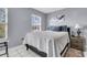 Comfortable bedroom with natural light features modern decor and soft, inviting bedding at 4791 Arco Ln, North Charleston, SC 29418