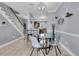 Inviting dining room with a glass table, seating for four, and easy access to the kitchen at 4791 Arco Ln, North Charleston, SC 29418