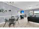 Cozy living room features tile floors, modern decor, and access to a lovely outdoor view at 4791 Arco Ln, North Charleston, SC 29418
