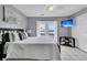 A view of the main bedroom that includes balcony access, ceiling fan, and TV at 4791 Arco Ln, North Charleston, SC 29418