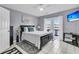 Bright main bedroom with balcony access, a ceiling fan, and a TV at 4791 Arco Ln, North Charleston, SC 29418