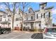 Charming townhomes with varied facades, complemented by individual front porches and convenient parking in front at 4791 Arco Ln, North Charleston, SC 29418
