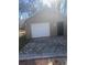Garage with white door, side entrance and a cobblestone drive at 4793 Popperdam Creek Dr., North Charleston, SC 29418