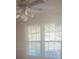 Bright room featuring a ceiling fan and natural light streaming through a large window at 4793 Popperdam Creek Dr., North Charleston, SC 29418