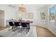 Dining room with shiplap walls, ample natural light, and a rustic wooden table at 519 Bank St, Mount Pleasant, SC 29464