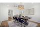 Inviting dining room with long wooden table, stylish chairs, and modern pendant lighting at 519 Bank St, Mount Pleasant, SC 29464