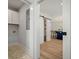 Hallway view of laundry area with sliding barn door and into open kitchen at 519 Bank St, Mount Pleasant, SC 29464