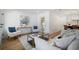 Open-concept living area with modern furniture, stylish decor, and seamless flow into the kitchen at 519 Bank St, Mount Pleasant, SC 29464