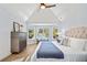 Bright bedroom with vaulted ceiling, lots of windows, ceiling fan and neutral decor at 519 Bank St, Mount Pleasant, SC 29464