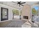 Inviting outdoor space with a fireplace, fan, and view of the outdoors at 519 Bank St, Mount Pleasant, SC 29464