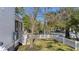 Well-maintained side yard with a lush lawn and a white picket fence at 519 Bank St, Mount Pleasant, SC 29464