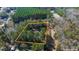 Aerial view highlighting the approximate boundaries of a house with a pool in a lush, wooded area at 5334 Charleston Highway Hwy, Walterboro, SC 29488