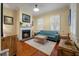 Cozy living room with fireplace, wood floors, neutral walls, and ample natural light at 54 Warren St, Charleston, SC 29403