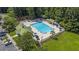 Aerial view of the community pool and rec area shows the clubhouse and parking at 544 Beverly Dr, Summerville, SC 29485