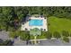 Aerial view showcases the community pool, clubhouse, and surrounding wooded area at 544 Beverly Dr, Summerville, SC 29485