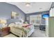 Cozy bedroom featuring a ceiling fan, a comfortable bed, and a window with a view at 544 Beverly Dr, Summerville, SC 29485