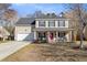 Charming two-story home with a well-maintained lawn and an inviting front porch at 544 Beverly Dr, Summerville, SC 29485