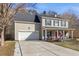 Charming two-story home with a two-car garage, covered front porch and inviting curb appeal at 544 Beverly Dr, Summerville, SC 29485