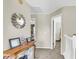 Hallway with a sunburst mirror, accent table and doorways at 544 Beverly Dr, Summerville, SC 29485
