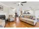 Inviting living room with hardwood floors, a fireplace, and a view of the open kitchen at 544 Beverly Dr, Summerville, SC 29485