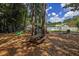 Community playground featuring play equipment, picnic tables and white fences at 544 Beverly Dr, Summerville, SC 29485