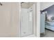 A modern glass shower stall with a sleek design, and view into the primary bedroom at 544 Beverly Dr, Summerville, SC 29485