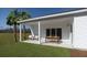 Covered patio with outdoor dining area and a view of the spacious backyard at 640 Cottage Landing Drive, Summerville, SC 29485