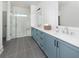 Modern bathroom with a walk-in shower, floating shelves, and dual vanity at 640 Cottage Landing Drive, Summerville, SC 29485