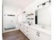 Modern bathroom with a walk-in shower, floating shelves, and dual vanity at 640 Cottage Landing Drive, Summerville, SC 29485