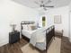 Cozy bedroom featuring wood-look floors, neutral walls, and comfortable bed with decorative pillows at 640 Cottage Landing Drive, Summerville, SC 29485