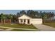 Charming single-story home boasting a covered front porch, manicured lawn, and attached two-car garage at 640 Cottage Landing Drive, Summerville, SC 29485