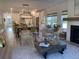 Open-concept living room and kitchen with white cabinets and a dining area at 640 Cottage Landing Drive, Summerville, SC 29485