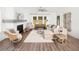 Bright living room boasts a fireplace, hardwood floors, and neutral furniture at 640 Cottage Landing Drive, Summerville, SC 29485