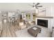 Open-concept living room and kitchen with white cabinets and a dining area at 640 Cottage Landing Drive, Summerville, SC 29485