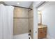 Bathroom with tiled shower and granite countertop vanity at 65 Surfsong Rd, Kiawah Island, SC 29455