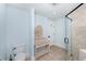 Bathroom features a toilet, shower with glass door, tile flooring, and vanity with mirror at 65 Surfsong Rd, Kiawah Island, SC 29455