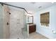 Bathroom showcasing a glass-enclosed shower, granite vanity and tile flooring at 65 Surfsong Rd, Kiawah Island, SC 29455