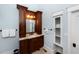 A wood vanity with drawers and cupboard doors, a stone countertop and a vessel sink at 65 Surfsong Rd, Kiawah Island, SC 29455