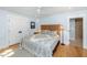 Bedroom features hardwood floors, a ceiling fan, and ensuite bathroom at 65 Surfsong Rd, Kiawah Island, SC 29455