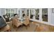 Bright breakfast nook with a glass table, six chairs and access to the patio at 65 Surfsong Rd, Kiawah Island, SC 29455
